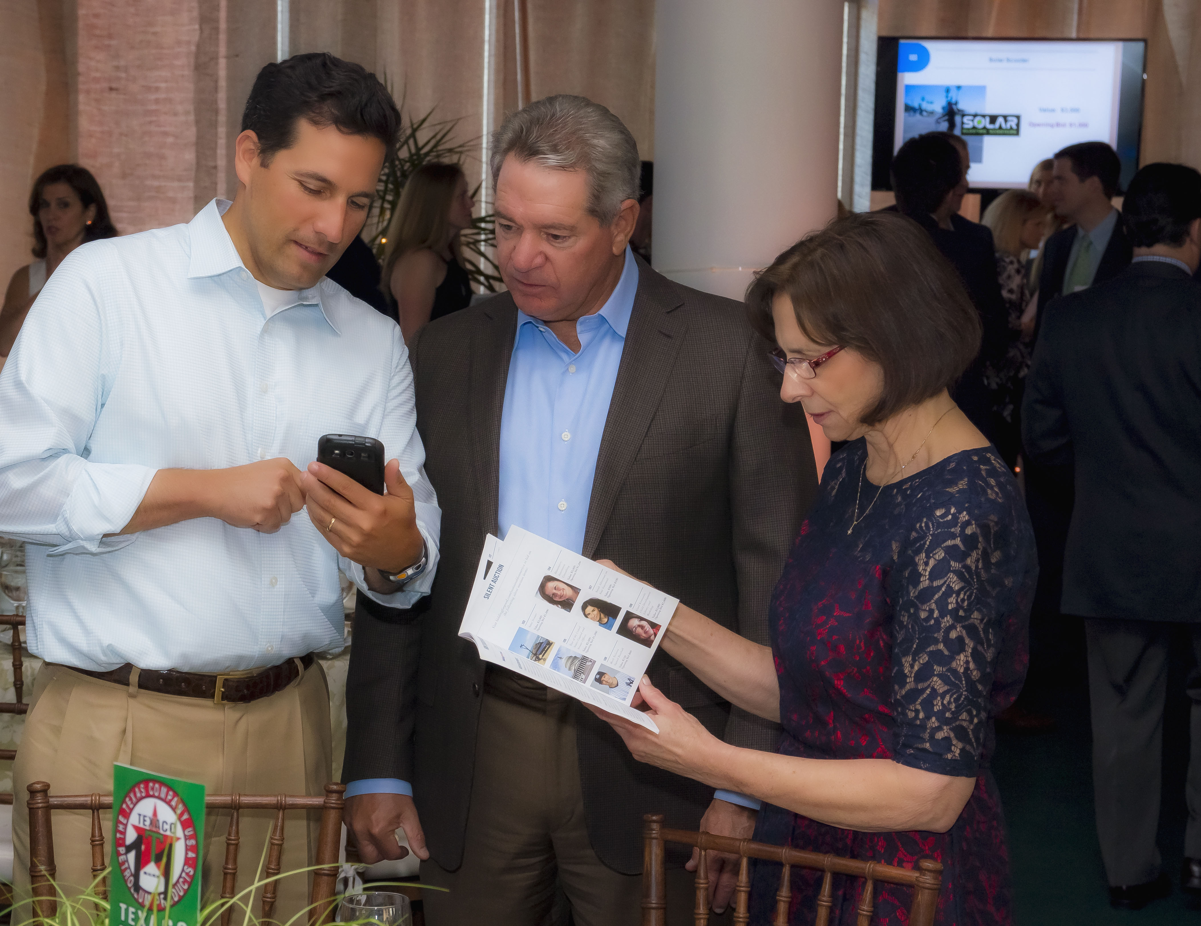 Gala attendees bidding on their phones